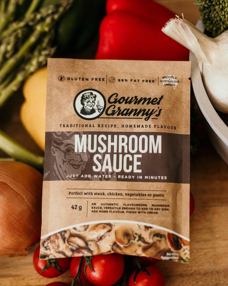 Gourmet Granny's Mushroom Sauce package on a wooden surface with vegetables in the background