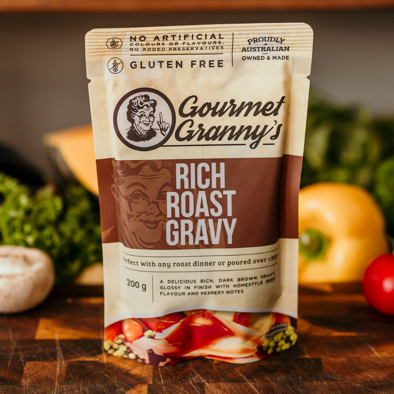 Gourmet Granny's Rich Roast Gravy packet on a wooden surface with vegetables in the background