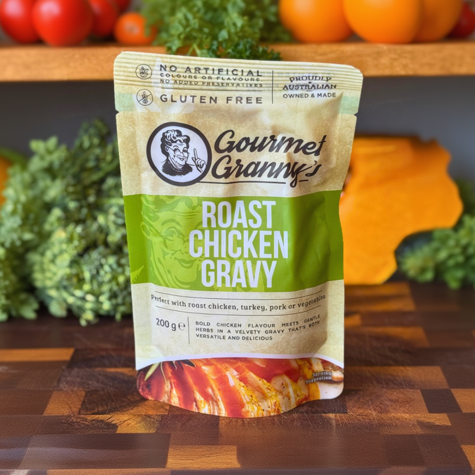 Gourmet Granny roast chicken gravy packet on a wooden surface with vegetables in the background